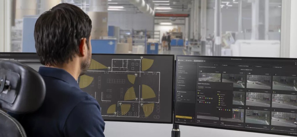 Operator watching Axis Camera Station Pro across two monitors